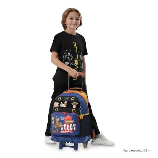 Child holding a colorful suitcase with character designs on a white background