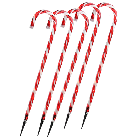 Red and white striped sticks with black tips on a white background