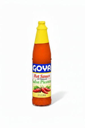 A bottle of Goya Hot Sauce Salsa Picante with orange-red sauce, a yellow cap, and a blue, red, and yellow label.