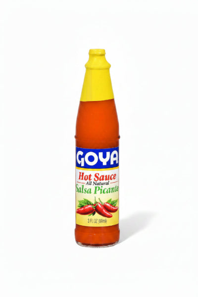 A bottle of Goya Hot Sauce Salsa Picante with orange-red sauce, a yellow cap, and a blue, red, and yellow label.